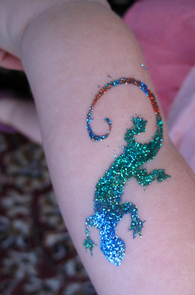 lizard glitter tattoo by Auntie Stacey