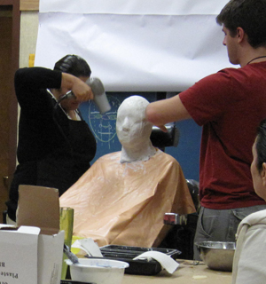 Drying the plaster bandages during live casting process