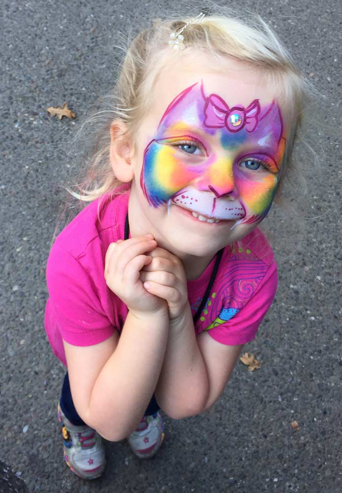 Rainbow kitty cat painted by Auntie Stacey's Face Painting