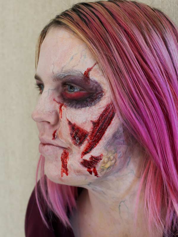 Ripped Face Zombie by Auntie Stacey Dennick, www.auntiestaceysfacepainting.com special effects, fantasy makeup for the San Francisco Bay Area
