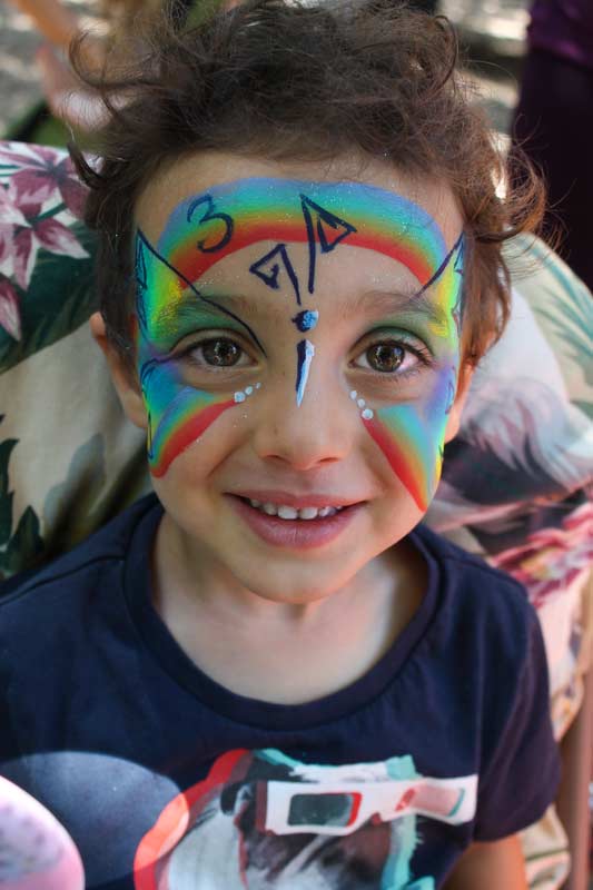 Rainbow butterfly for a three year old's birthday party by www.auntiestaceysfacepainting.com SF Bay area face painter Auntie Stacey Dennick