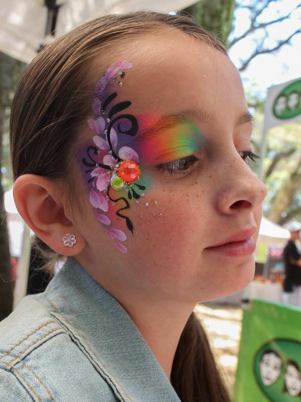 Rainbow eye bling with gems by Auntie Stacey's Face Painting www.auntiestaceysfacepainting.com SF Bay area face painter Auntie Stacey Dennick Sebastopol Santa Rosa Best wine country face painter!
