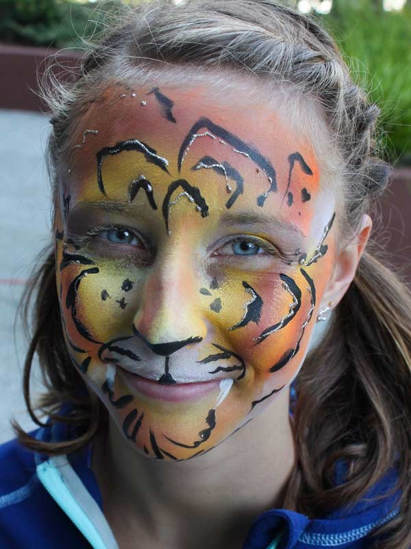 Tiger girl Rainbow eye bling with gems by Auntie Stacey's Face Painting www.auntiestaceysfacepainting.com SF Bay area face painter Auntie Stacey Dennick Sebastopol Santa Rosa Best wine country face painter!