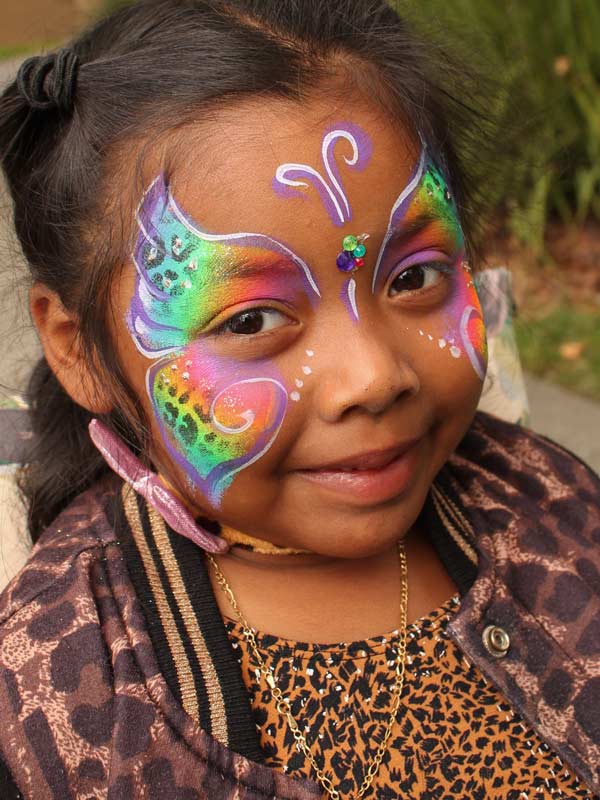 Butterfly leopard face paint by Auntie Stacey's face painting, balloon twisting, children's entertainer, fun and games, best wine country face painter, Sonoma county