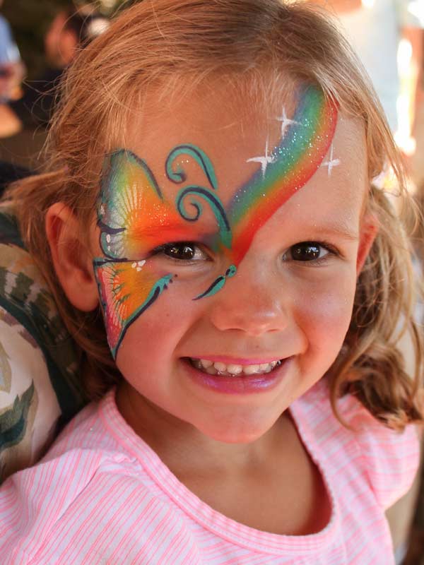 Rainbow butterfly face paint by Auntie Stacey's Face Painting, Sonoma county, Santa Rosa, Sebastopol, Petaluma, wine country face painter, SF bay area face painter