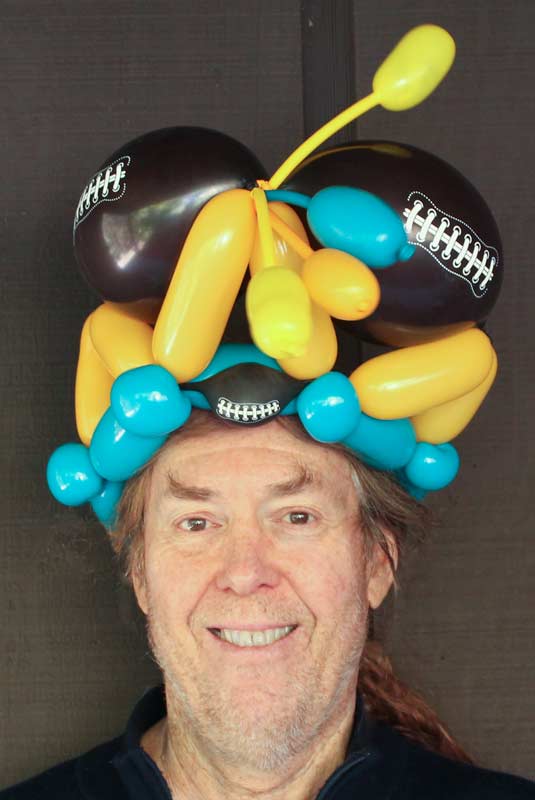 Football balloon hat by Auntie Stacey's Face Painting, balloon twisting, children's entertainment, party, kids, clown, fun, wine country face painter (415) 246-1227