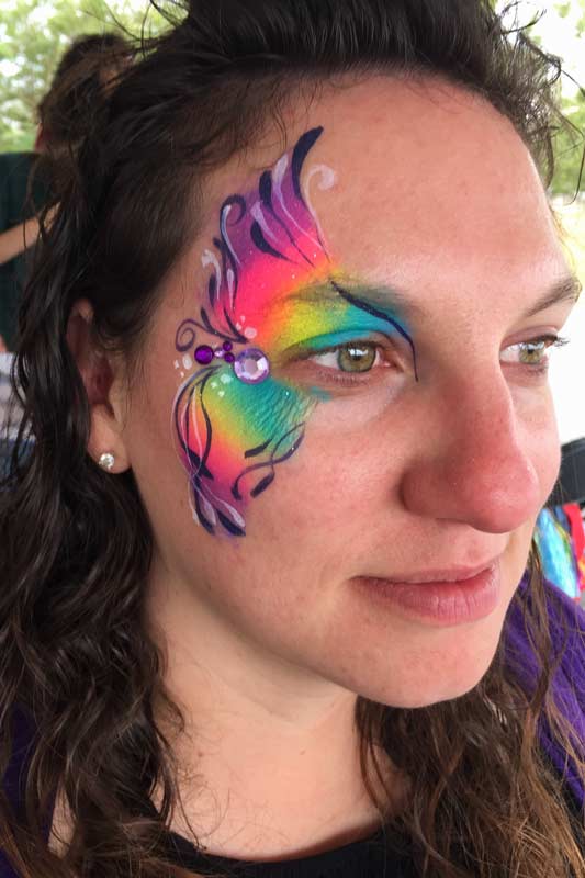 Rainbow eye Auntie Stacey's Face Painting, balloon twisting, children's entertainment, party, kids, clown, fun, wine country face painter