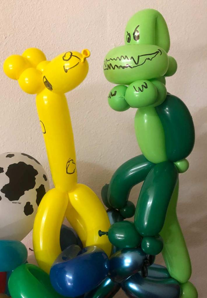 Giraffe and dinosaur balloons By Auntie Stacey's Face Painting